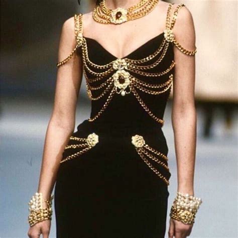 chanel black dress with gold chain